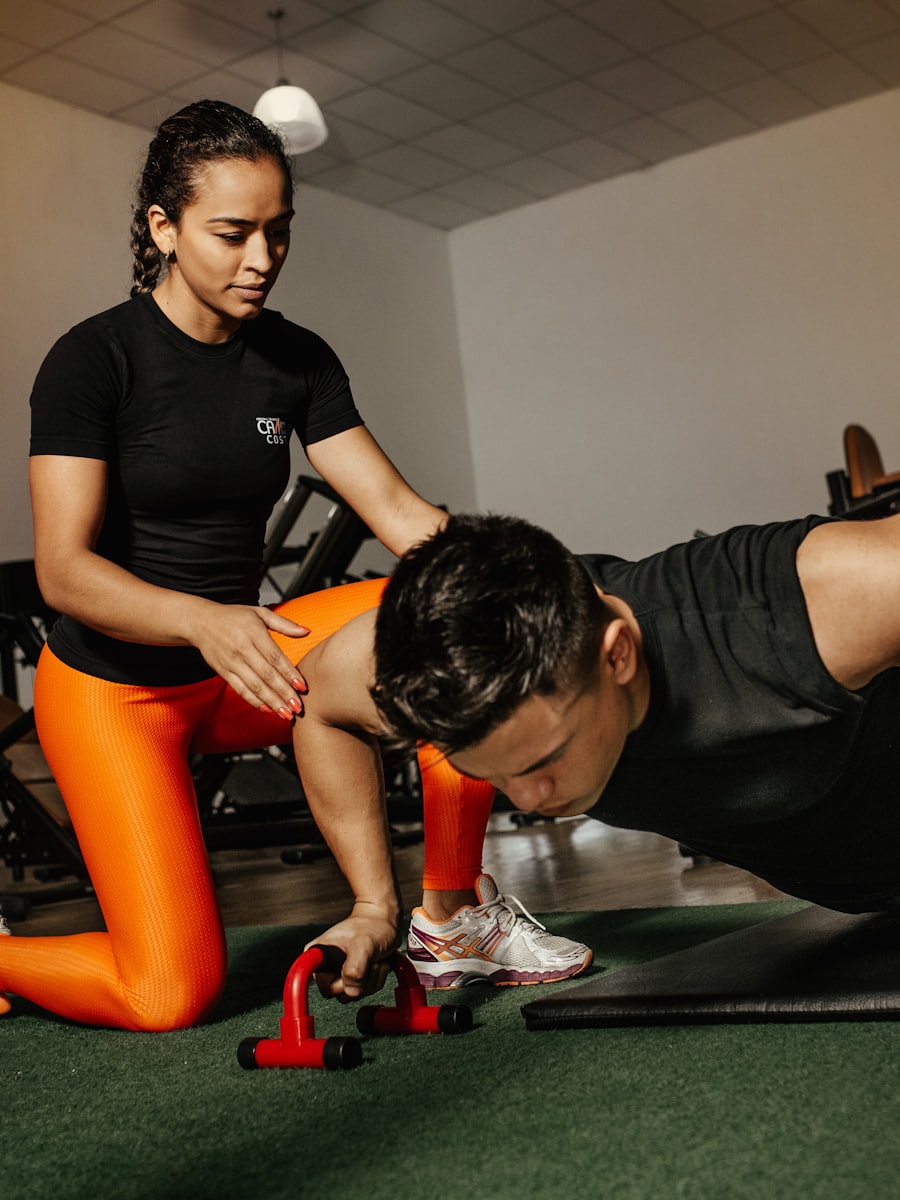 A trainer coaching someone through an exercise one-to-one